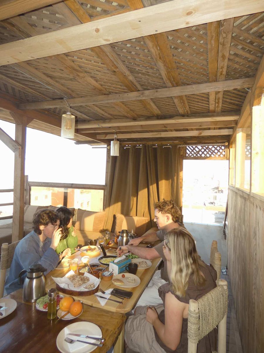 Group meal at the covered rooftop table